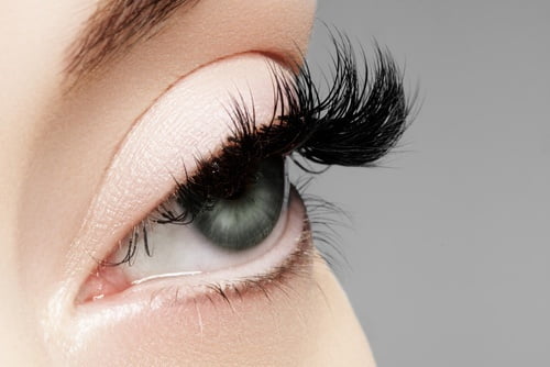Beautiful macro shot of female eye with extreme long eyelashes a